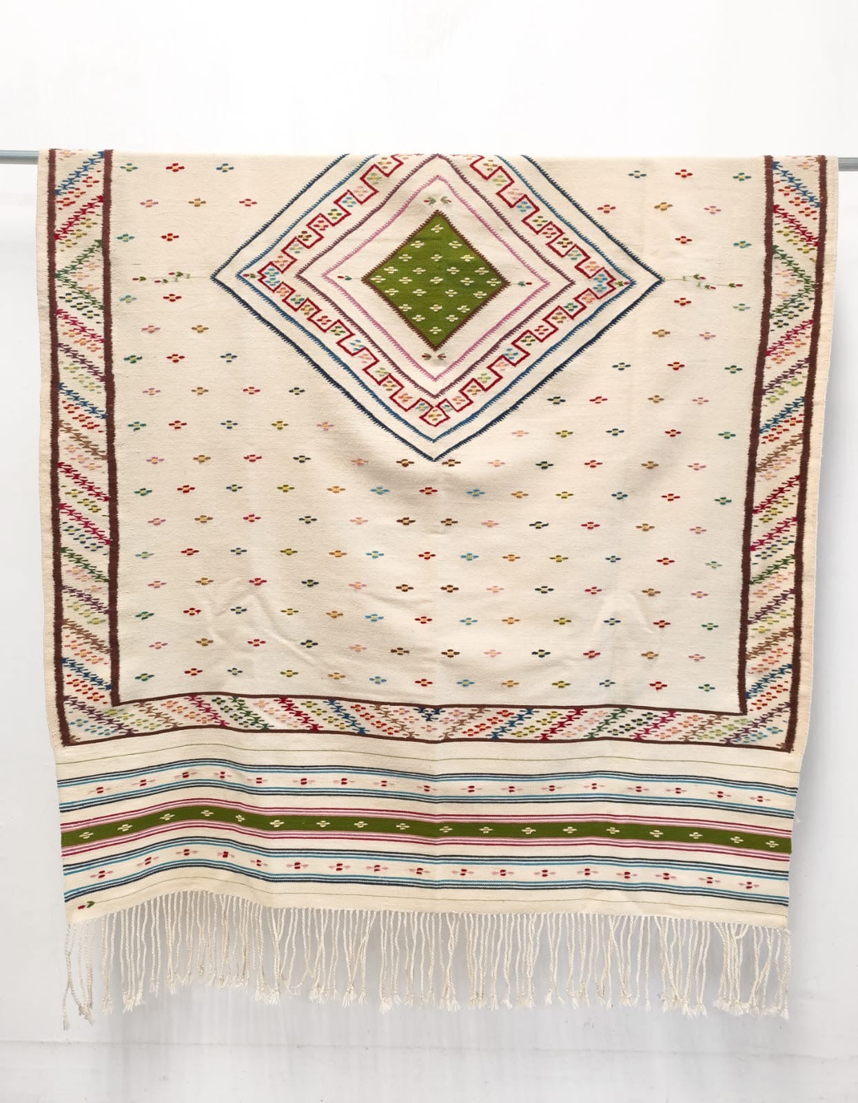 Flores de Naranjo - handwoven cream sarape with scattered floral motif and diamond medallion by Marina Netzahualcoyotl, Indian Market 2026