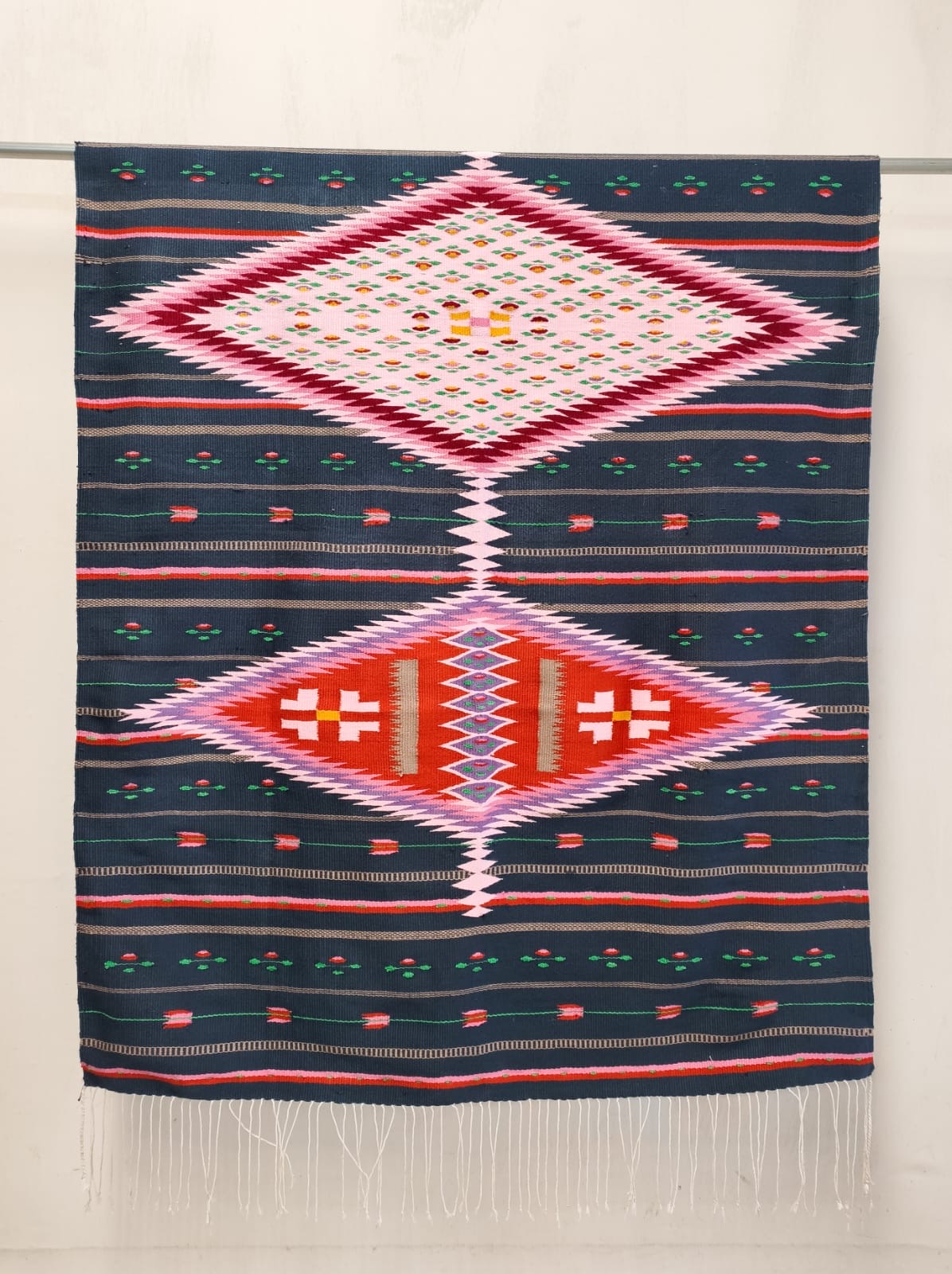 Las Florecitas y Sus Secretos - 1st Place National Sarape Competition 2025, handwoven navy sarape with twin diamond medallions by Leonor Netzahualcoyotl